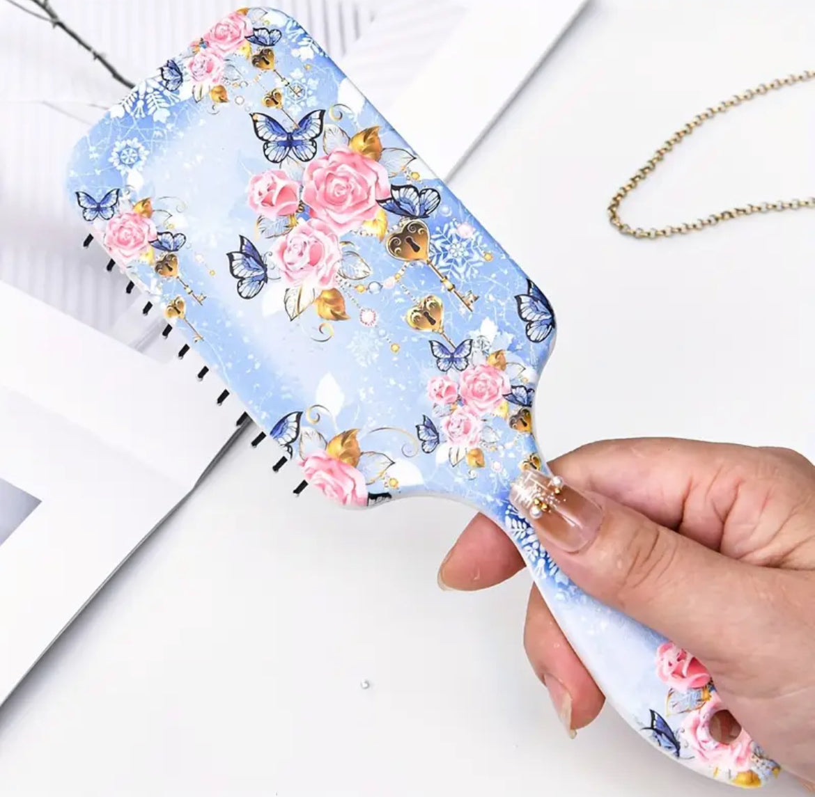 فرشاة شعر مضادة للكهرباء الساكنة مع وسادة هوائية مريحة، بنقشة زهرة زرقاء