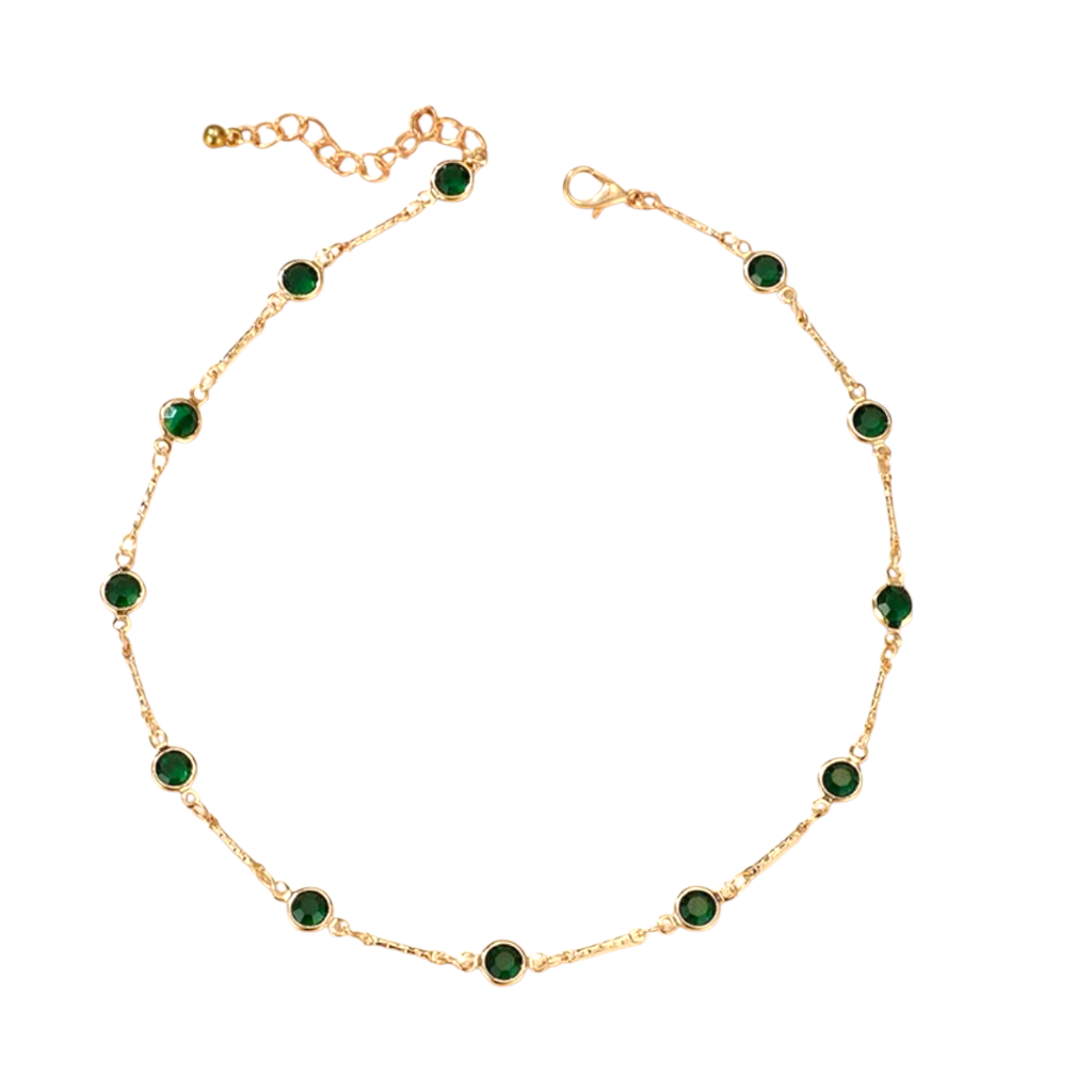سوار ذهبي بسلسلة مرصعة بأحجار خضراء