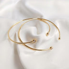 سوار مذهل مرصع بالزركون ومطلي بالذهب